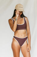 Model wearing the September The Line Barrel Dodger Dad Hat surf-inspired adjustable cap