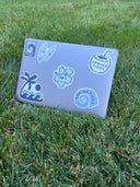 A photo of the spring tides sticker pack on a laptop