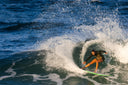 Action photo of the Atmosea Bella Springsuit 2mm surfing.