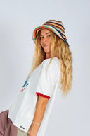 Model wearing the Atmosea Crochet Hat with a striped hand-crocheted design.