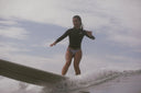 Action photo of the Atmosea Luna Jacket Front Zip 2mm surfing.