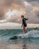 Surfer wearing the Atmosea Mars Springsuit 2mm riding a wave.