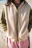 Close-up of the Atmosea Surf Coach Front Zip Vest showing the front zip and fleece texture.