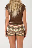 Back view of the Inner Relm 90 Star Tee paired with striped shorts.