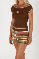 Full-length front view of the Inner Relm 90 Star Tee paired with striped shorts.