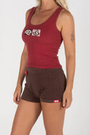 Full-length front view of the Inner Relm Checkers Top paired with brown shorts.