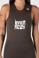 Close-up of the Inner Relm Drop Knee Long Jane 2mm showing the chest logo and neckline.