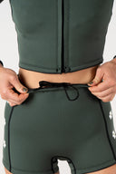 Close-up of the Inner Relm Green Envy Shorts 2mm showing the adjustable internal drawstring and waistband.