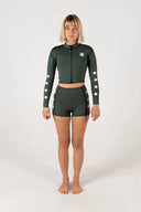 Model wearing the Inner Relm Green Envy Vest 2mm with the matching neoprene shorts.