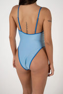 Back view of the Inner Relm Poolside One Piece showing the adjustable straps and moderate coverage.
