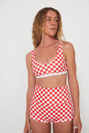 Model wearing the Salt Gypsy Bralette Bikini Top in Chilli Checkers paired with matching swim bottoms.