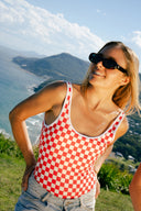 A model outside wearing the Salt Gypsy Everyday One Piece in Chilli Checkers