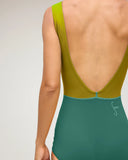 Close-up of the Seea Lido One Piece in Tropical Green showing the deep V-back.