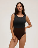 Front view of a model wearing the Seea Pacific One Piece swimsuit in Black/Cappuccino featuring a high neckline, deep V-back, and cheeky coverage.