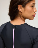 Close-up of the Seea Swami's Playsuit in Olive showing the back zipper detail.