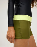 Close-up of the Seea Swami's Playsuit in Olive highlighting the integrated shorts.