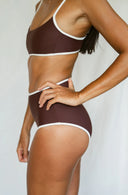 Side view of model  wearing the River Bikini Top in Cold Brew