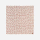 Slowtide Hau Oversized Beach Blanket with a soft floral print.