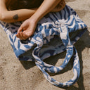 Close-up of the Slowtide Sunny Terry Tote Bag showing the terry fabric, handles, and floral pattern.