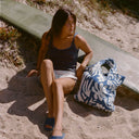 Person carrying the Slowtide Sunny Terry Tote Bag outdoors.